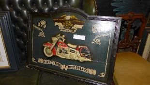 A Harley Davidson advertising sign - 'Live To Ride - Ride To Live'