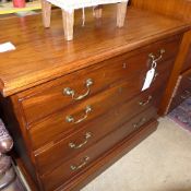A Georgian mahogany chest of four graduated drawers with brass drop handles on a plinth base