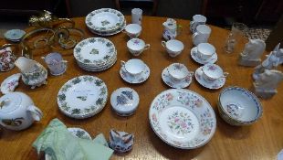 A miscellaneous collection of porcelain including winged angel, mugs, bowls and others