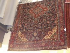 An extremely fine North West Persian Sarouk carpet the pendant floral medallion with Shah Abbas