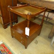 A pair of oak side tables with tooled leather insets and base drawers
