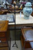 A cast iron three branch pricket stick