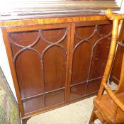 A mahogany bookcase with glazed panel doors