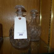 A pair of cut glass decanters and stoppers