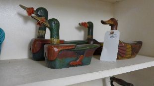 A set of four Chinese style decoy ducks