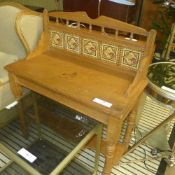 An Edwardian pine wash table with the inserts on turned supports