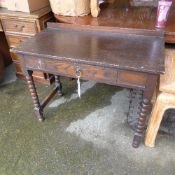 A C20th oak side table with single drawer on bobbin turned supports