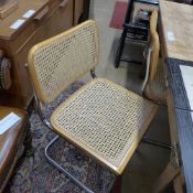 A set of four Marcel Breuer design dining chairs with cane seats and backs