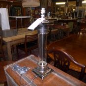 A chromium and glass table lamp