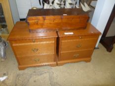 A pair of fruitwood bedside chests with two drawers