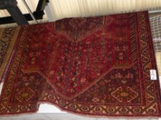 A fine South West Persian Qashgai carpet the central pendant medallion on a terracotta field guarded