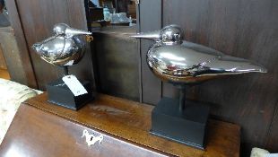 A pair of chromium model seagulls on stand