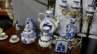 A collection of blue and white Delft style wares including table lamp vases and others