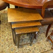 A C20th oak nest of bobbin support tables