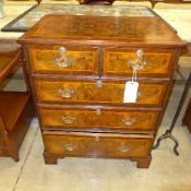 A C20th walnut chest having two short three long drawers on bracket feet W 72 D 46 H 88 cm