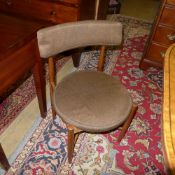 A set of four G-plan chairs with pad back and seat