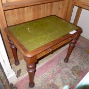 A Victorian mahogany side table with tooled leather top above drawer of diminutive proportions