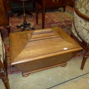 A C19th mahogany cellarette with division interior of sarcophagus form