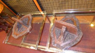 A pair of C19th carved hardwood Eastern folding wall brackets with flowers and deities in relief