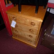 A satinwood chest of small proportions fitted four drawers on plinth base
