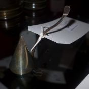 A hallmarked silver candle snuffer