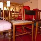 A C19th elm and beech stickback side chair with pad seat upholstered in tapestry fabric