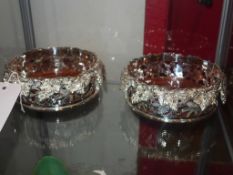 A silver plated wine coaster with grapevine detail in relief