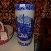 A pair of blue and white ironstone umberella stands with Chinese landscape pattern