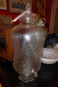 A lidded cut glass punch barrel with tap