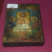 A Greek hand painted Icon on panel heightened in gilt