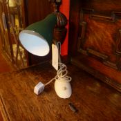 A 1950`s German desk lamp with green shade on adjustable supports
