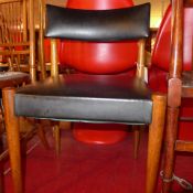 A Danish style teak desk chair upholstered in black leather