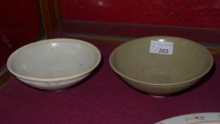 A Chinese beige glazed Song dish and a similar [2]