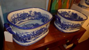 A pair of blue and white oval form Ironstone planters decorated with Chinese landscape pattern