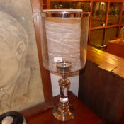 A pair of glass and silver plated table top storm lanterns of large size