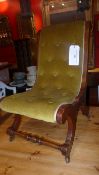 An Edwardian walnut childs slipper chair upholstered in buttoned velour