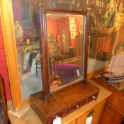 A Georgian mahogany swing frame toilet mirror fitted three drawers