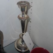 A pair of C19th silver plated candlesticks