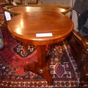 A Victorian mahogany occasional table the circular top raised on faceted support and platform base