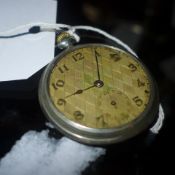 A white metal (possibly silver but unmarked) pocket watch in working order