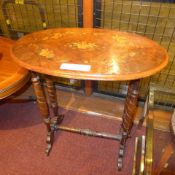 A Victorian inlaid walnut oval form occational table raised on turned supports and castors