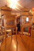 A pair of French oak side cabinets with carved upstand above inset marble and single drawer and