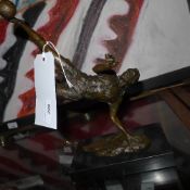A bronze model of a footballer on marble pedestal base