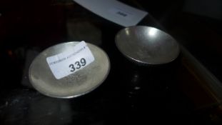 A pair of Chinese silver coin dishes