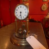 A brass mantel clock (missing glass dome and a/f)