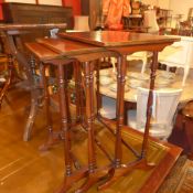 An Edwardian inlaid mahogany nest of three tables on turned stretchered supports