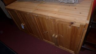 A pair of contemporary pine cabinets fitted pair of panel doors enclosing shelves