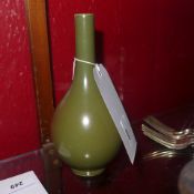A Chinese tea dust glaze vase with a slender neck