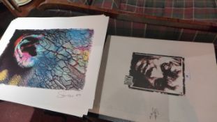 A set of eight unframed 'maske' art prints in folio