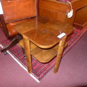 An Art Deco walnut occasional table of square shape and two tiers